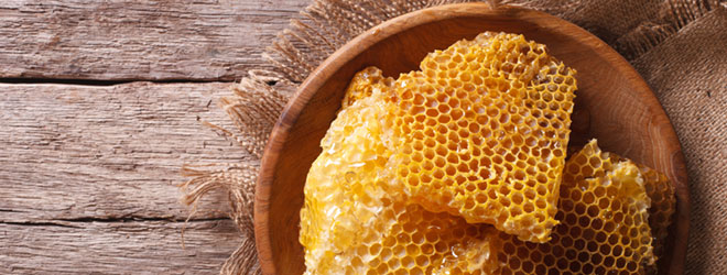 Honeycomb in a bowl. Verify your honey source with True Source Certification.