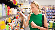 Woman choosing personal care products in a store