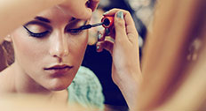 Woman having make up applied