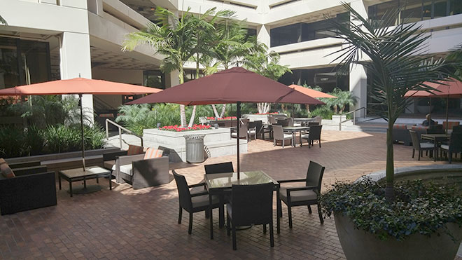 Outdoor tables with umbrellas.