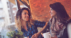 Two women sitting in a cafe